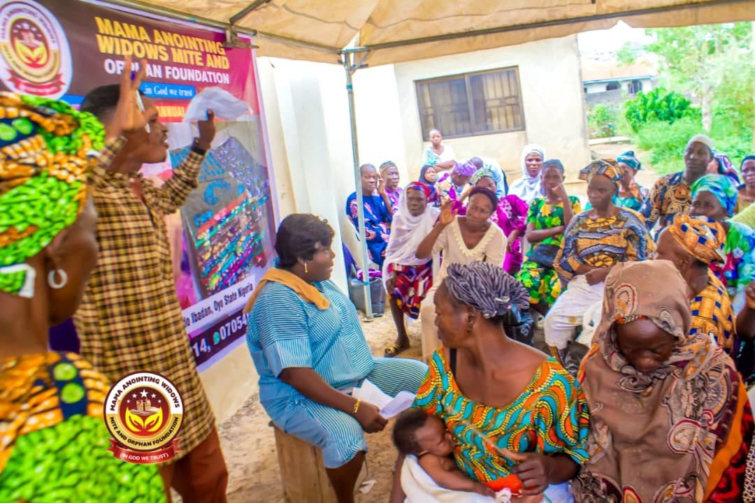 Widows and community members gathered during a foundation programme